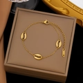 Golden titanium steel bracelet with three shell charms and adjustable lobster clasp - Three Shell Bracelet (E2187) / Gold