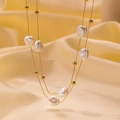 Double-layered gold titanium necklace with baroque pearls and beads on silk background - Irregular Artificial Pearl Necklace (H1072) / Gold