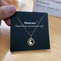 Golden titanium necklace featuring a black round pendant with a crescent moon and star design - Gold Black Disc Moon Star Style (X507 Gold)