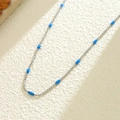 Collier minimaliste en acier titane avec perles bleues et entretoises argentées - Style Acier à Perles Bleues (X1278) / Bleu/Argent
