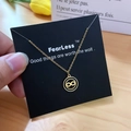 Golden infinity symbol necklace with black inlay on a display card for women - Gold Black Disc Infinity Style (X510 Gold)
