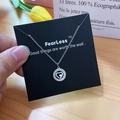 Silver heart pendant necklace with shimmering crystals on a black gift card - Silver Hollow Heart Style (X512 Silver)