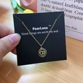 Elegant gold titanium interlocking hearts necklace displayed on a black premium card - Gold Interlocked Heart Style (X524 Gold)