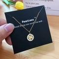 Elegant gold four-leaf clover pendant necklace with micro-pave crystals on a display card - Gold Four-leaf Clover Style (X525 Gold)