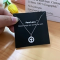 Silver circle cross necklace with white zircon pavé setting on a black display card - Silver Cross Style (X528 Silver)