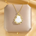 Elegant gold titanium steel necklace featuring a white Buddha pendant on a silk background - O-chain / White