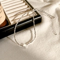 Detailed close-up of S925 sterling silver stamp on the delicate clover necklace - Four-Leaf Clover Style / Silver