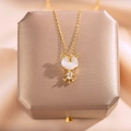 Squisita collana tigre d'oro con ciondolo occhio di gatto e zircone su sfondo di seta - Piccola Tigre Occhio di Gatto
