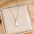 Titanium steel butterfly necklace with white shell inlay on a premium jewelry stand - Natural Shell / Silver (X710)