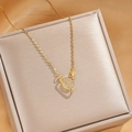 Elegant gold titanium steel necklace with a glittering cat-eye stone planet pendant - Gold Ringed Planet