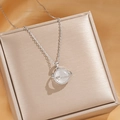 Silver planet necklace with opal stone and star pendant on a champagne silk jewelry box - Silver Opal Planet