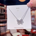 Silver bow necklace in titanium steel with cubic zirconia on a white card display - Silver Square Zirconia Bowknot