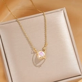 Golden planet necklace with pink cat eye stone and star pendant on silk padding - Colorful Planet