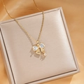 Elegant gold bow pendant necklace with heart shaped zircon stones on a fine chain - Gold White Zircon Bow