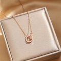 Rose gold double ring necklace with zircon inlay on a champagne satin jewelry box - Rose Gold Full Rhinestone Double Ring Necklace