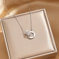 Silver double ring necklace with zircon inlay and Roman numerals on a jewelry box - Silver Roman Numeral Necklace