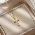 Sparkling gold cross necklace with full crystals on a champagne satin jewelry box - D57 Gold