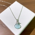 Collier en acier titane avec pendentif coquillage bleu et étoile de mer en zircon - Coquillage Étoile de Mer Bleu Argenté