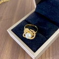 Golden camellia ring with white pearl and zircon accents in a velvet jewelry box - Gold Camellia Pearl Ring