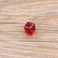 Macro shot of red cubic crystal charm with geometric facets for DIY jewelry making - Red