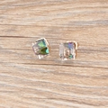 Detail macro view of square cut aurora crystal studs with multifaceted color reflections - Iridescent White