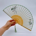 Bamboo embroidery folding fan with green tassel and elegant floral silk fabric - 2026 Hot Selling Item - Suzhou Embroidery Fan - Bamboo And Orchid Double Purity