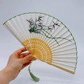 Traditional Chinese folding fan with bamboo ribs and green orchid embroidery on white silk - 2026 Hot Selling Item - Suzhou Embroidery Fan - Orchid And Bamboo