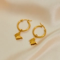 Detail of gold butterfly drop earrings with frosted wings on silk background - Matte Butterfly Pendant Earrings