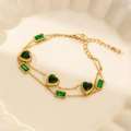 Detail of double-layer 18K gold bracelet featuring green heart and rectangular zircon stones - Heart Style with Green Square Zirconia