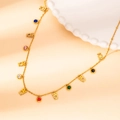Detail of gold chain necklace featuring colorful round gemstones and cat-shaped pendants - Owl Color Zirconia Style (N0159)