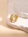 Golden matte ginkgo leaf open ring with hollowed design on white stone texture - Gold Ginkgo Leaf Style