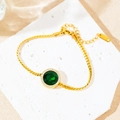 Pulsera de serpiente de acero titanio dorado con esmeralda y halo de diamantes - Pulsera de Redondo Esmeralda