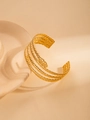 Detailed view of layered snake bracelet featuring golden serpent scales and abstract head design - Spiral Snake Pattern Style / Gold