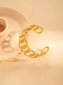 Detailed view of overlapping gold circles on a minimalist stainless steel cuff bracelet - Geometric Rings Style / Gold
