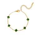Macro detail of gold-plated stainless steel bracelet with square emerald green crystals - Square Green Style (BJGB0022)