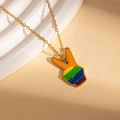 Detailed shot of golden stainless steel necklace with a rainbow colorful V-sign pendant - Peace Sign Stripe Rainbow Necklace (BJGN0471)