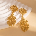 Detailed close-up of golden leaf-shaped earrings with textured organic patterns on stone - Coral Earrings (BJGE1183)
