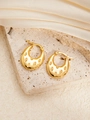 Detailed close-up of golden titanium steel earrings with textured oval groove patterns - U-Shaped E0261 Style