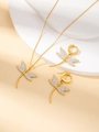 Detailansicht des Libellen Schmucksets mit Kristallen auf einem steinernen Podest - Libelle Schmuckset mit Strass / Gold