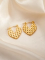 Macro view of gold heart hoop earrings with textured geometric grid pattern on silk background - Heart E0168 Style
