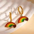 Rainbow pendant earrings in gold finish with a red heart charm on white marble - Red Heart Rainbow Bridge Earrings (BJGE1202)