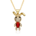 Detailed macro view of a gold-plated rabbit pendant with red stone and sparkling zircons - Rabbit with Red Stone (D533)