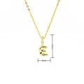 Detail showing gold bubble letter E pendant dimensions of 19mm by 9mm with zircon - Gold Style E