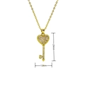 Detail view of gold heart key pendant with dimensions measuring 29mm in height and 13mm wide - Pink And White Zircon Heart Key (E569)
