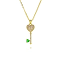 Macro view of gold heart key pendant with white zircon micro-pave and green gemstone - White And Green Zircon Key Pendant (E571)