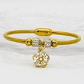 Gold leaf floral magnetic bracelet with shimmering rhinestones and a spinning pendant - 16cm