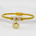 Detail of gold snake chain bracelet with magnetic clasp, sunflower pendant and FE text - 16cm