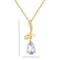 Elegante collana a fiocco dorata con gemma azzurra e dettagli in zircone lucido - Oro con pietra principale blu chiaro / Oro