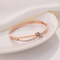 Elegant rose gold double-layered knotted cuff bracelet featuring sparkling pavé crystals - Rose Gold