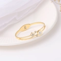 Elegant gold titanium steel cuff bracelet featuring shell flower and star clover patterns - Gold